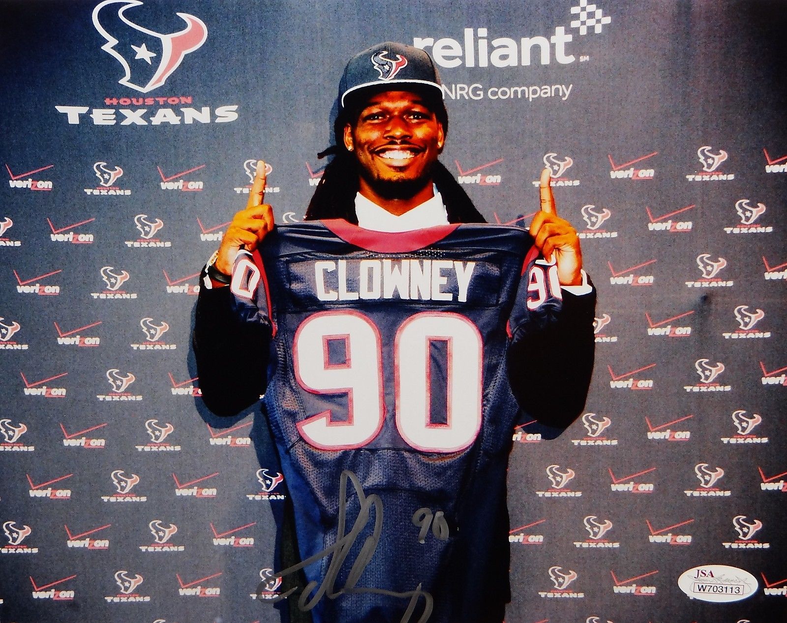 Jadeveon Clowney Autographed 8x10 Holding Texans Jersey Photo- JSA Authenticated